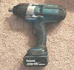 Makita BTW450 1/2" 18V Impact Wrench Blue Black W/ 5.0AH Li-ion Battery. Fixed Price $185.00.