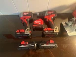 Milwaukee M18 Hammer Drill And Circular Saw Combo Kit W/ Charger Red (2992-22). Fixed Price $275.00.