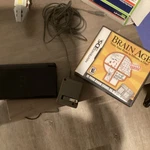 Nintendo Ds Lite Console With Brain Age Puzzle Game, Charger & Manual.. Fixed Price $78.86.