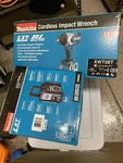 Makita XWT08T 1/2 Drive Impact Wrench Plus Bluetoothradio And Extra Battery. Fixed Price $699.00.