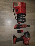 Milwaukee Impact Wrench & Ratchet Set, Li-ion, 18V/12V, Batteries, Red/black. Fixed Price $320.00.